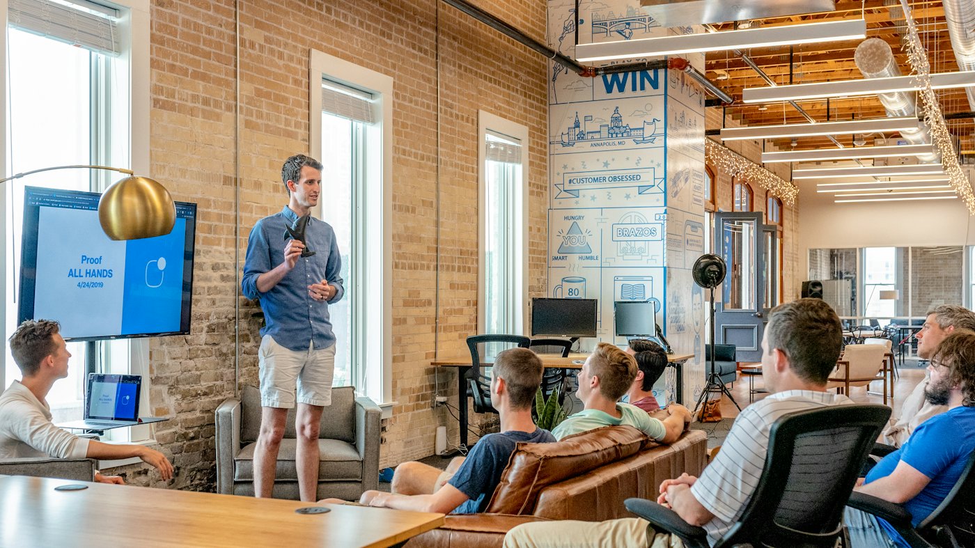 Someone leading a relaxed training session in an office